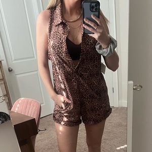 Skatie Romper is Cheetah Print